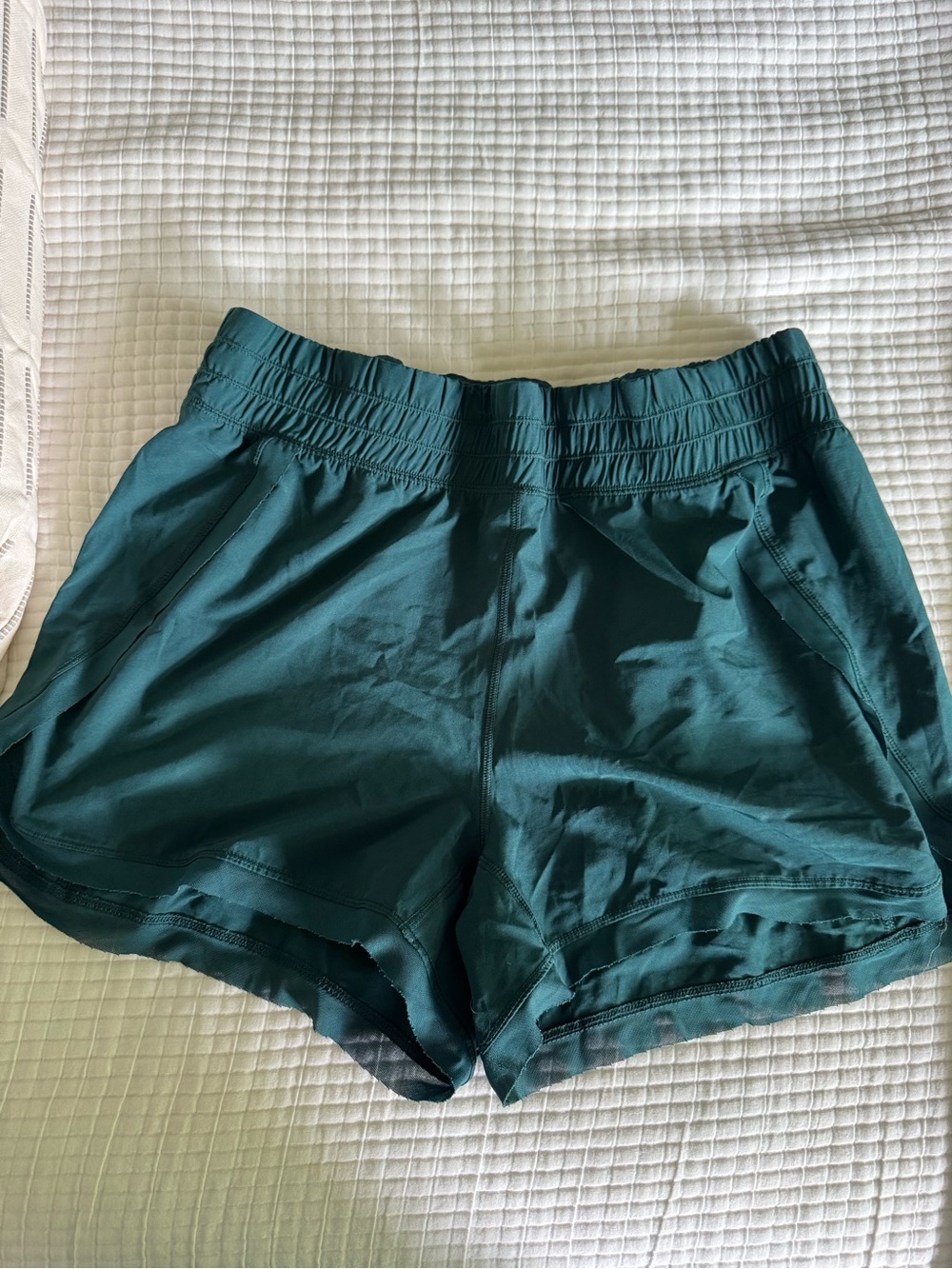 Green track shorts